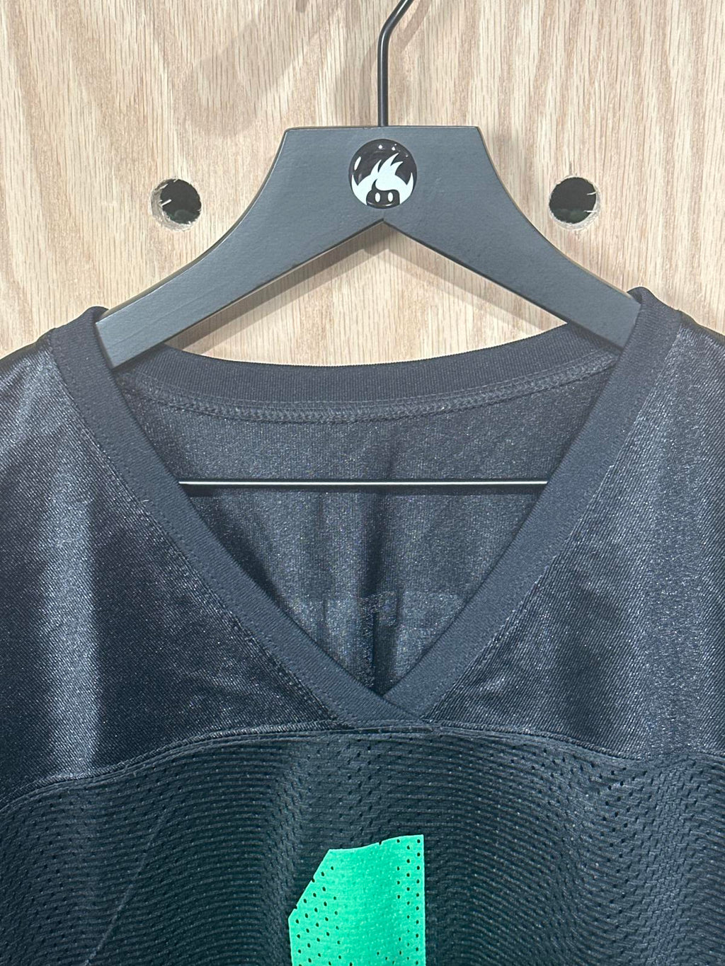 Woman's Black Athletic Jersey with Green Number 1