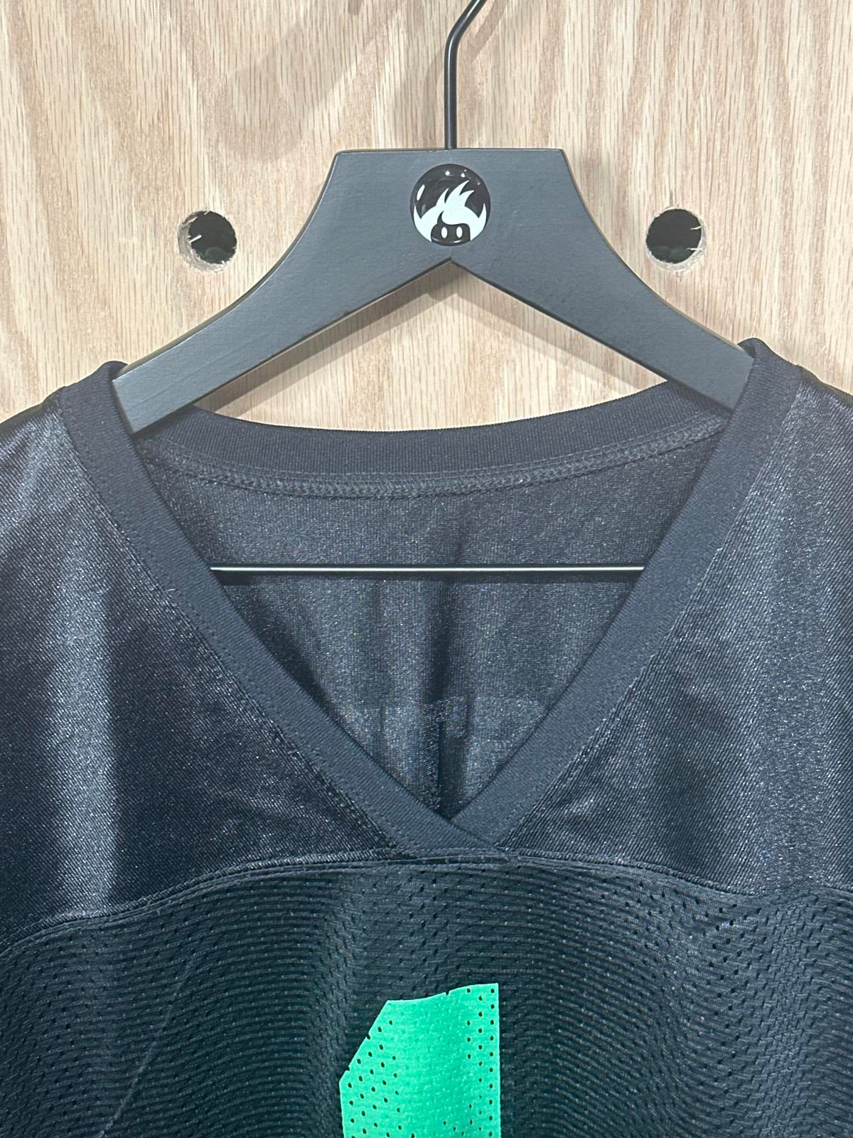 Woman's Black Athletic Jersey with Green Number 1